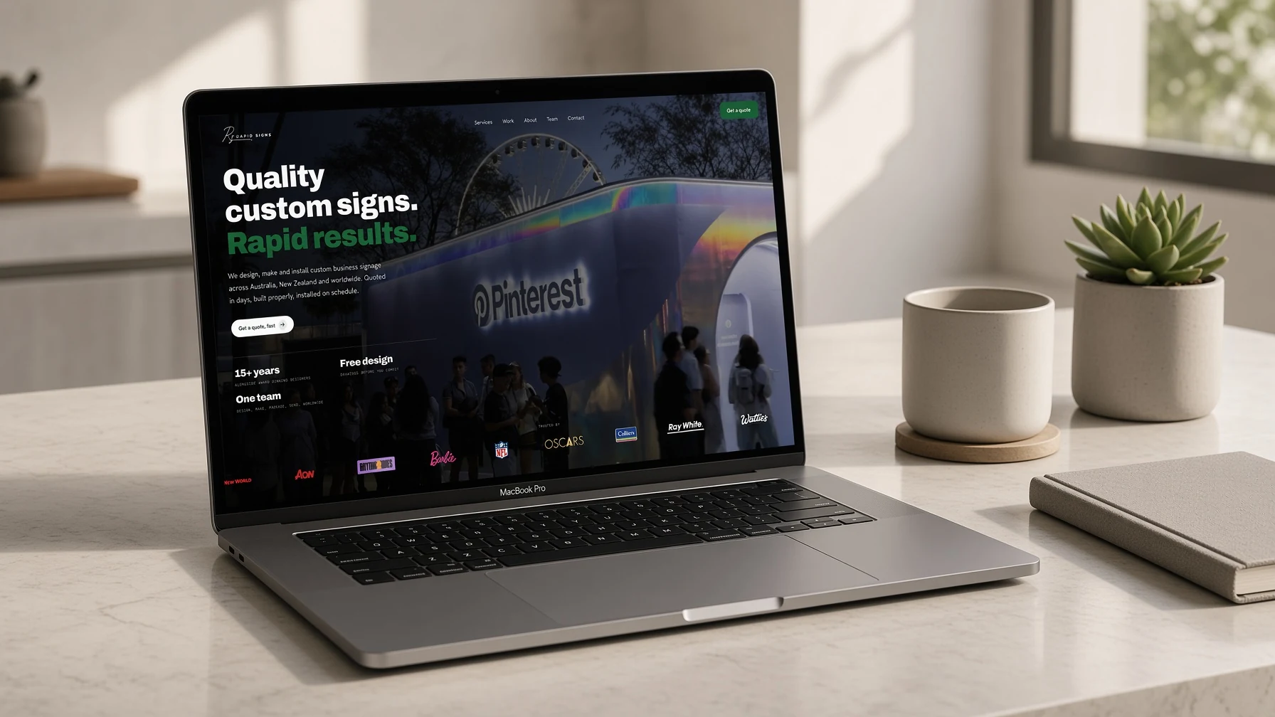 Rapid Signs homepage displayed on a laptop in a bright studio